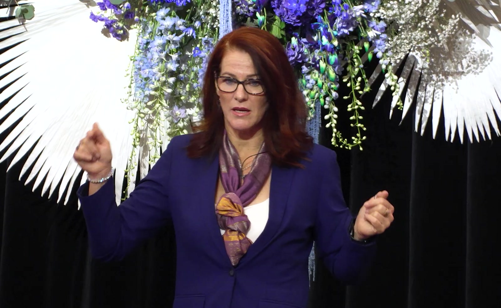Angela Hucker telling a story mid-keynote