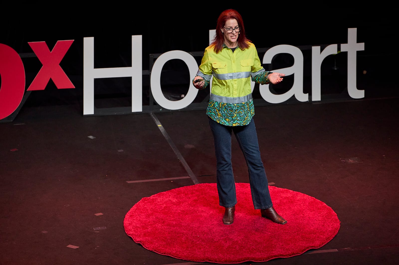 Angela Hucker speaking on the TEDx stage